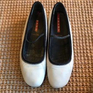 White Prada slip on flats